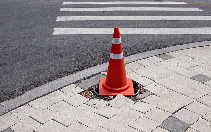 What dangers do construction trenches pose?